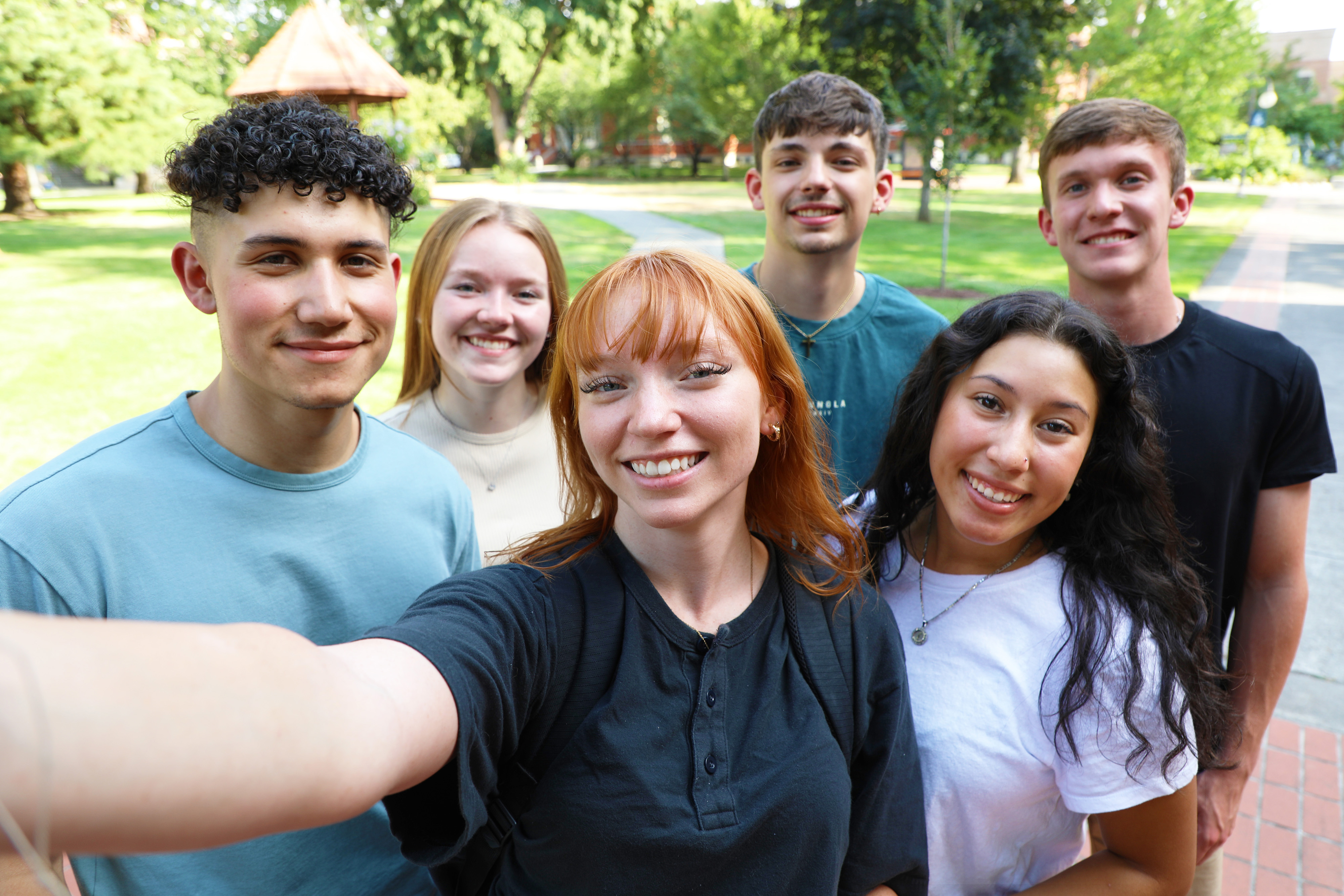 Group of students taking a selfie on campus
