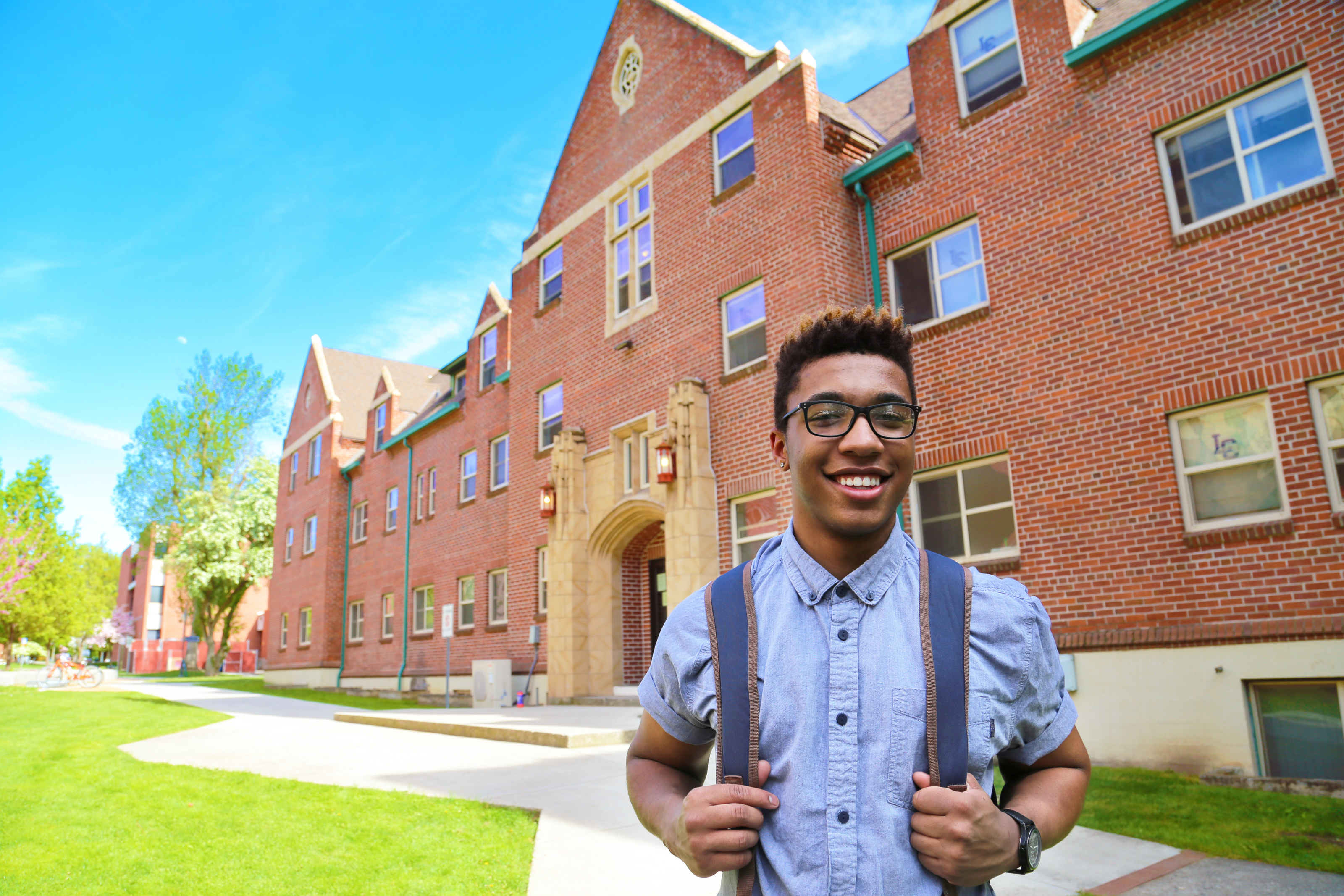 Student in front of dorm