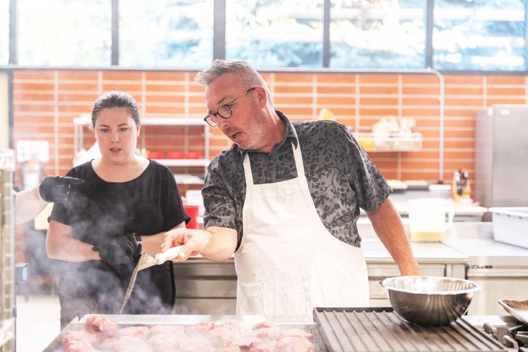 Rodney Farrington cooking with students