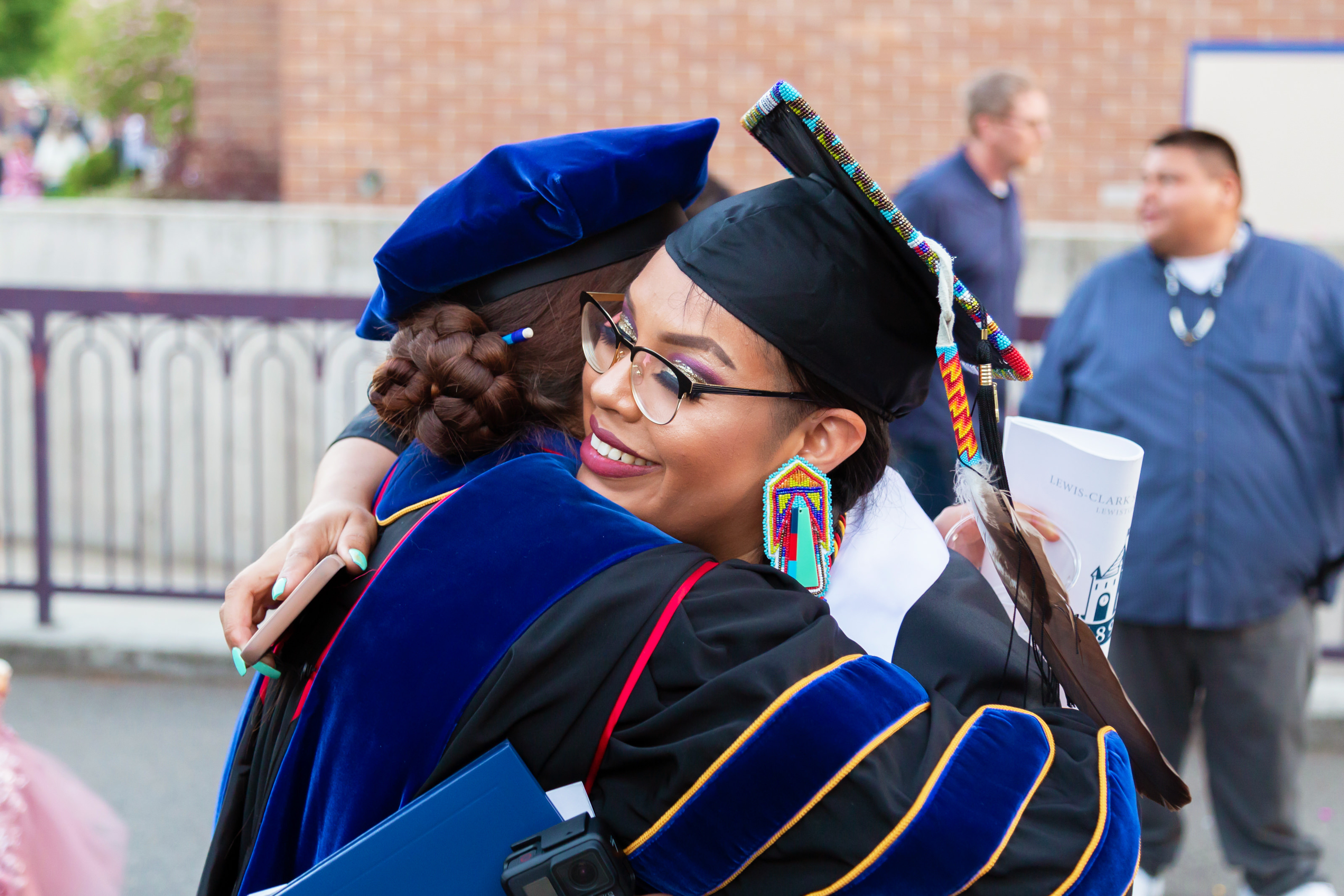 Graduate being greeted after the ceremony