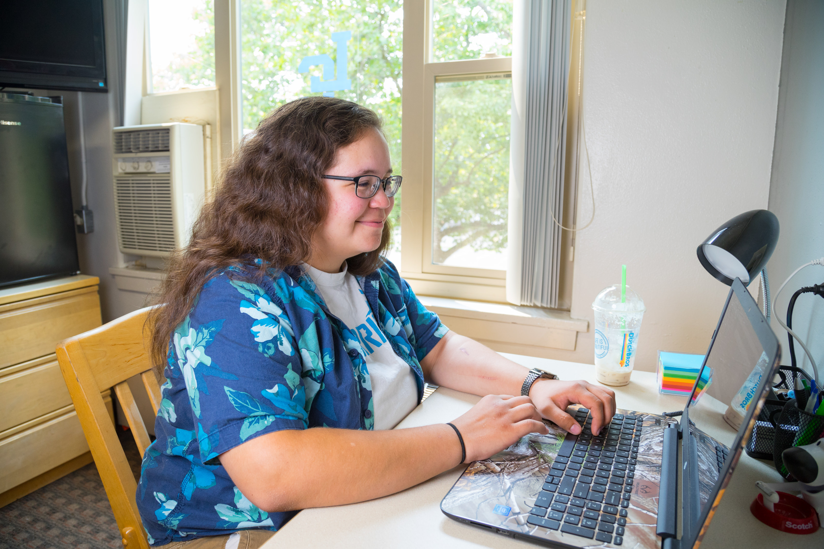Student studying in her dorm room