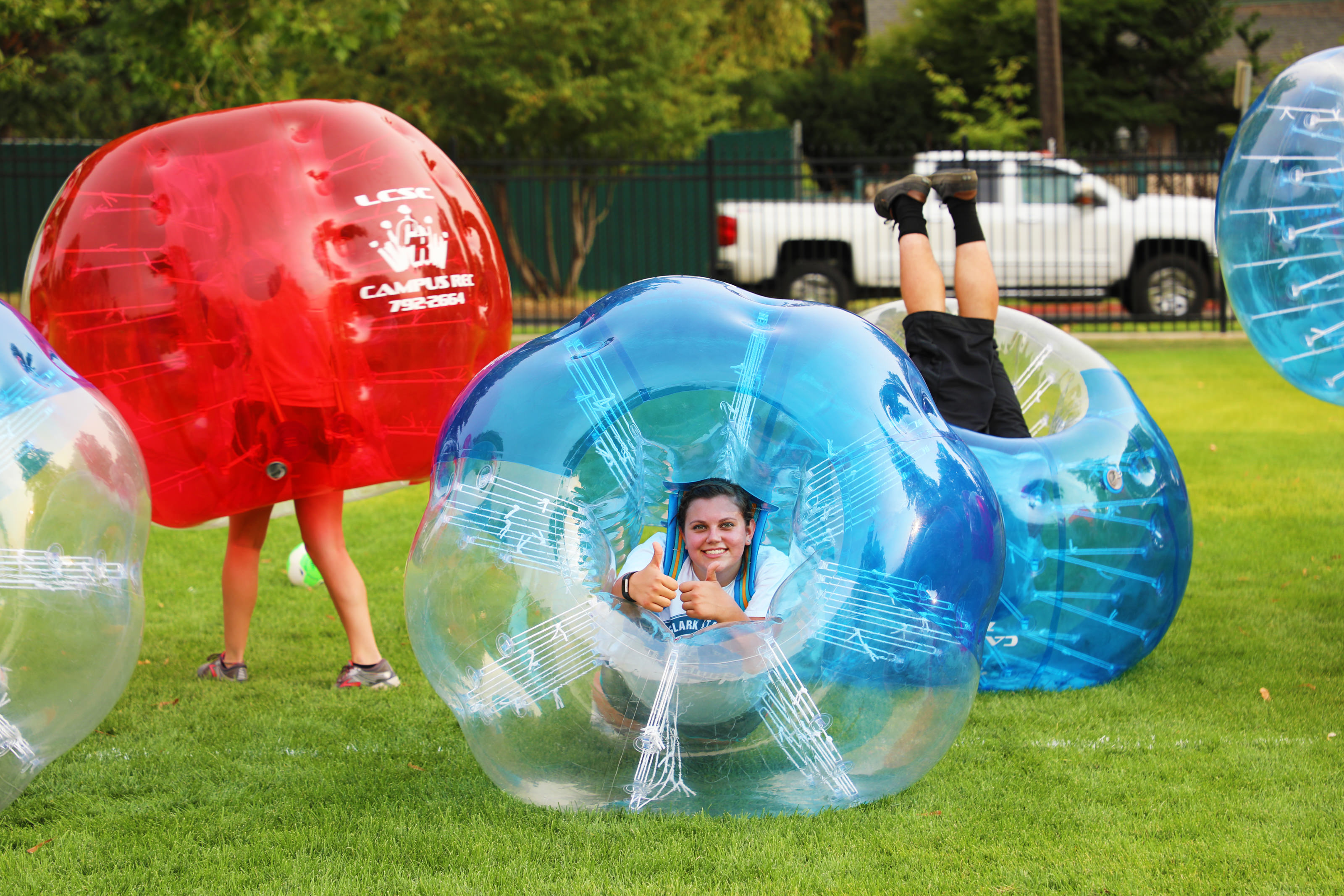 Students in plastic bouncy bubbles