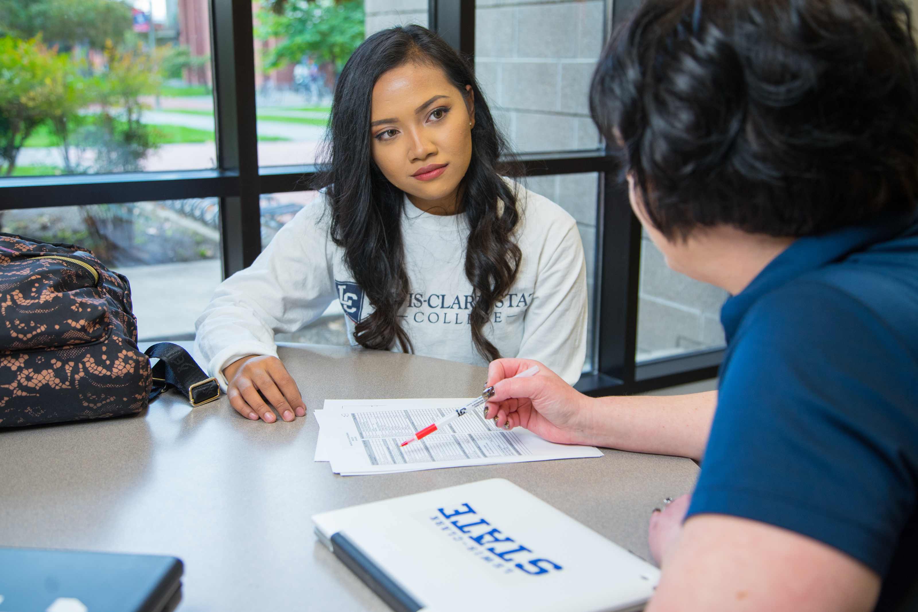 Student working with an advisor