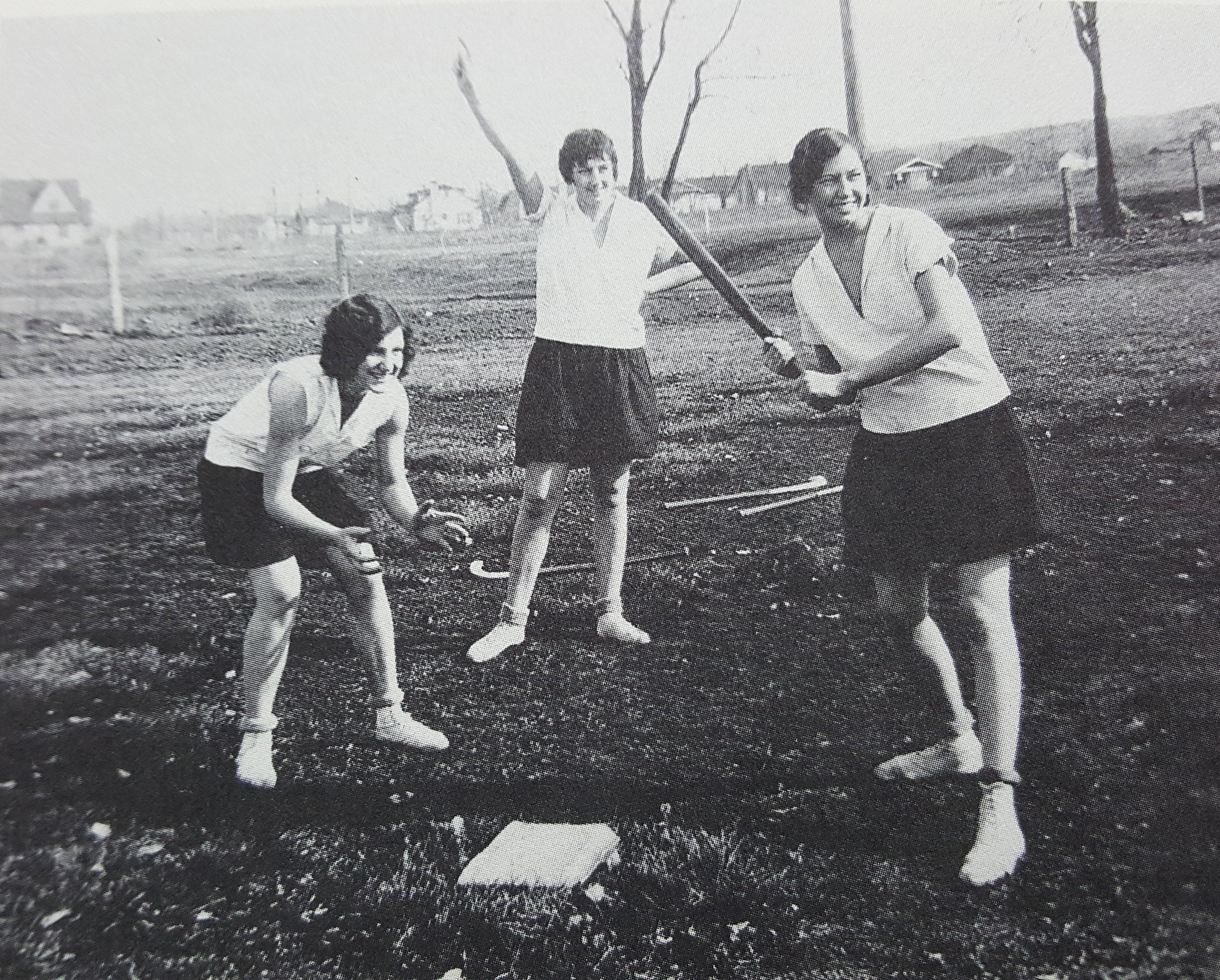 Black and White photo of three girls playing baseball in the 1920's