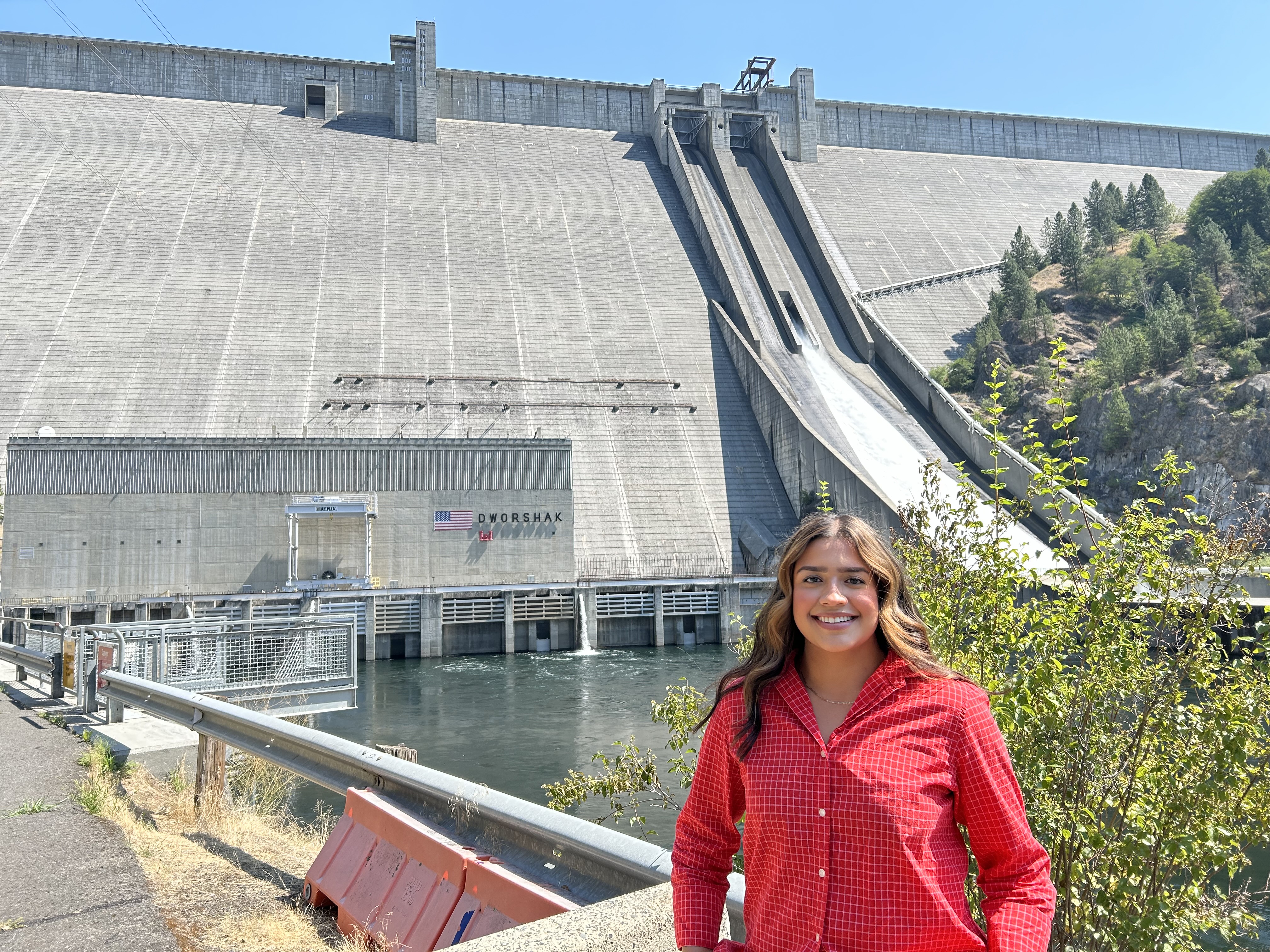 LC State Student Adriana Enriquez-Gonzalez poses in front of Dworshak Dam 