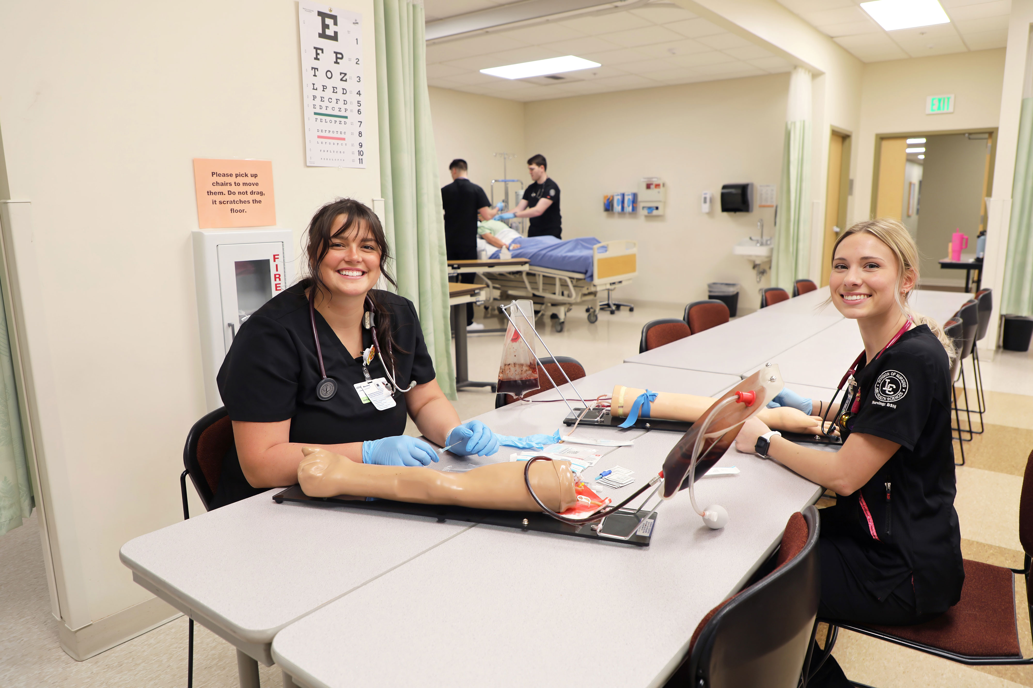 Nursing students practice inserting IVs