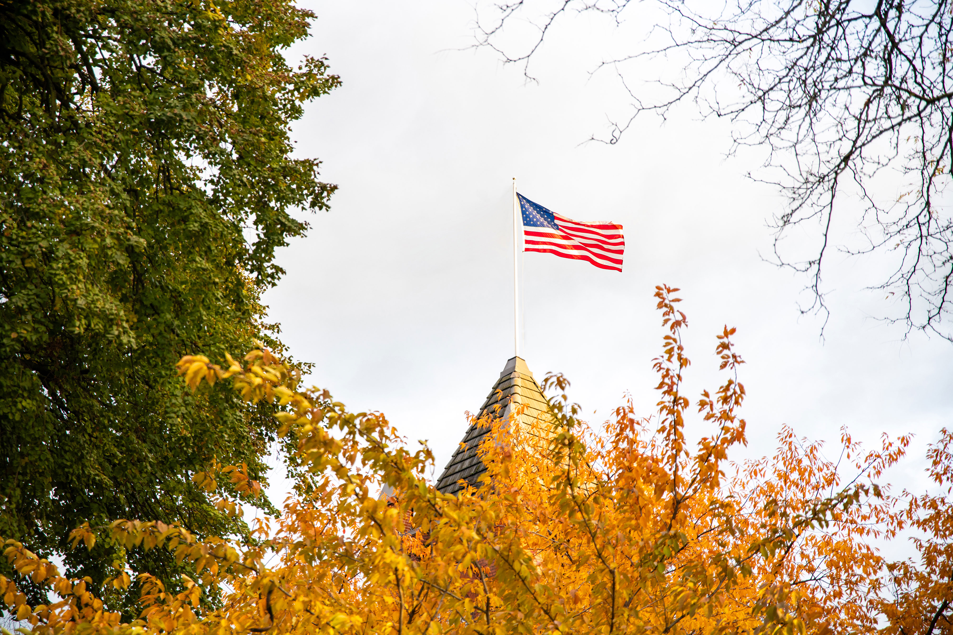 An American flag waves in the breeze on the LC State campus