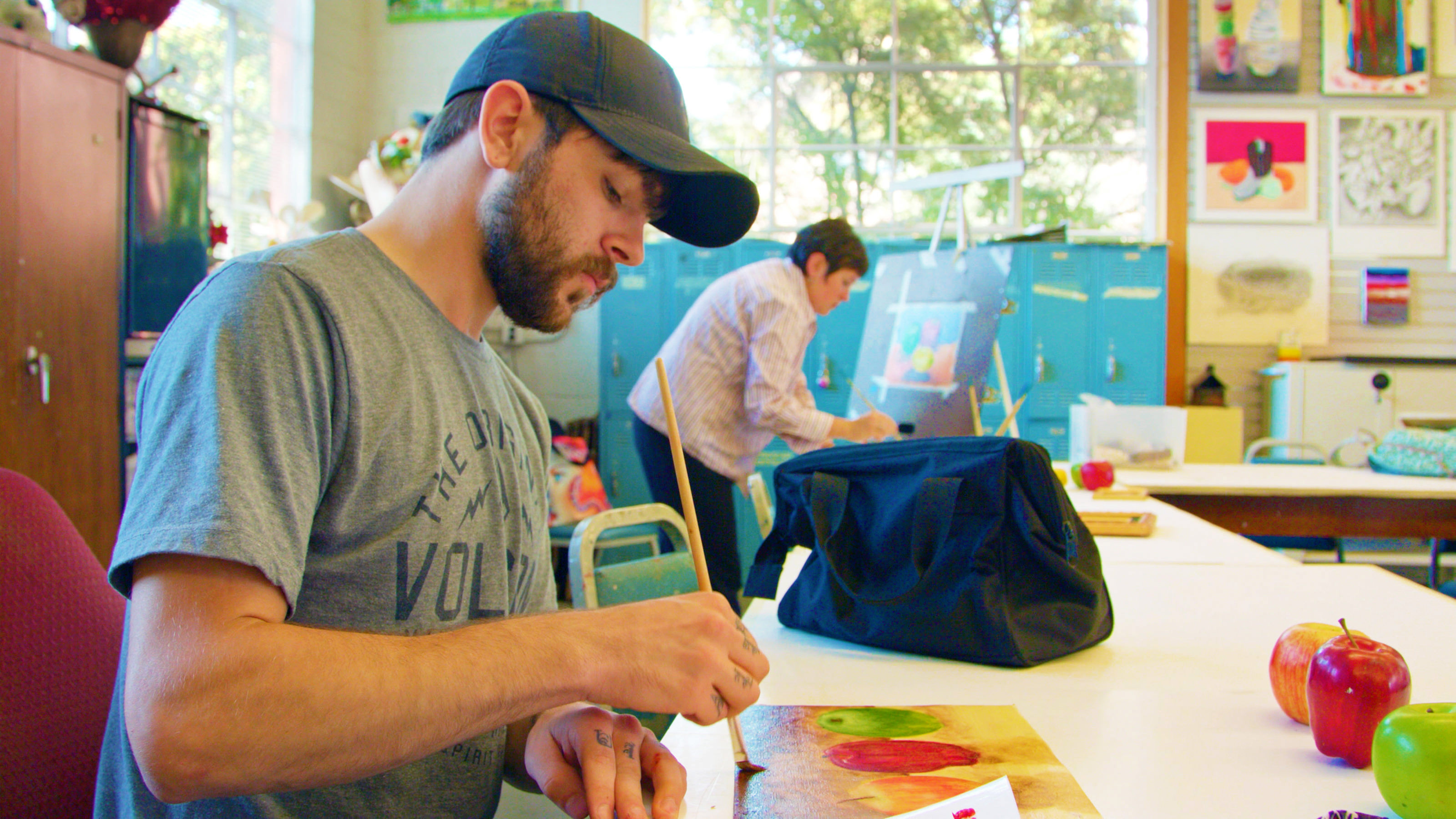 Male art student in class painting