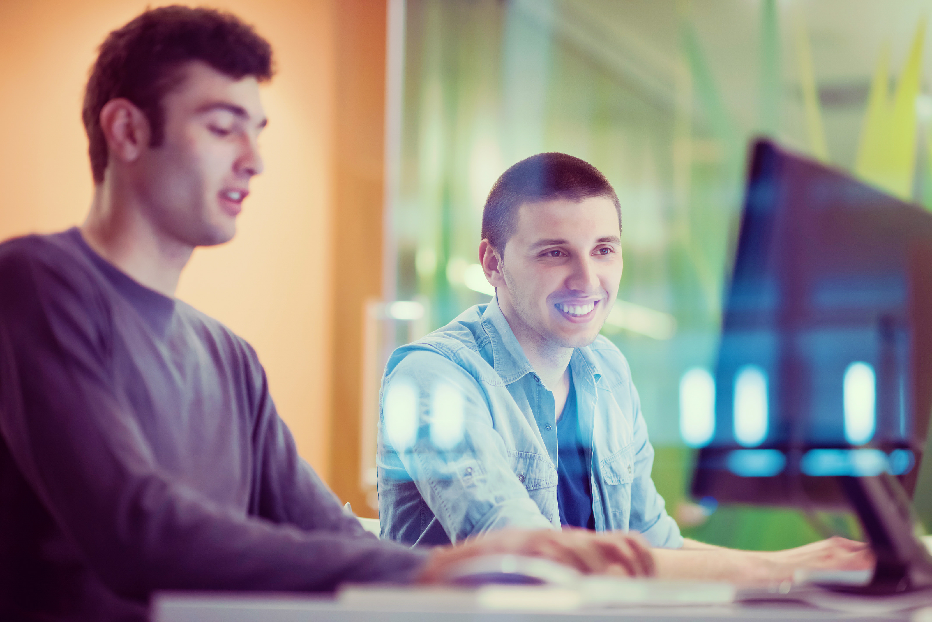 Two males students at a computer