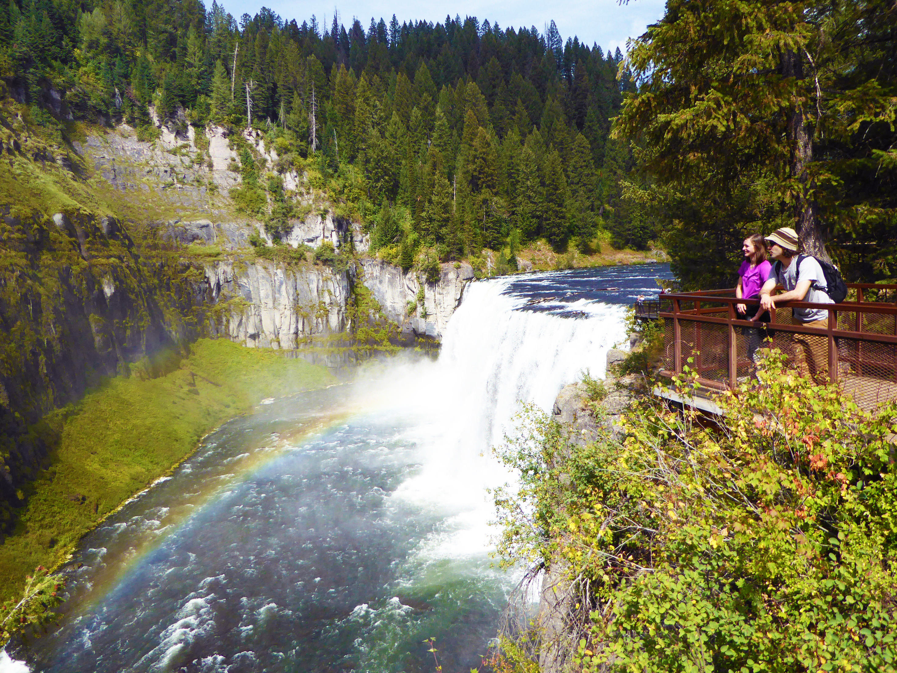 Two students looking at waterfall