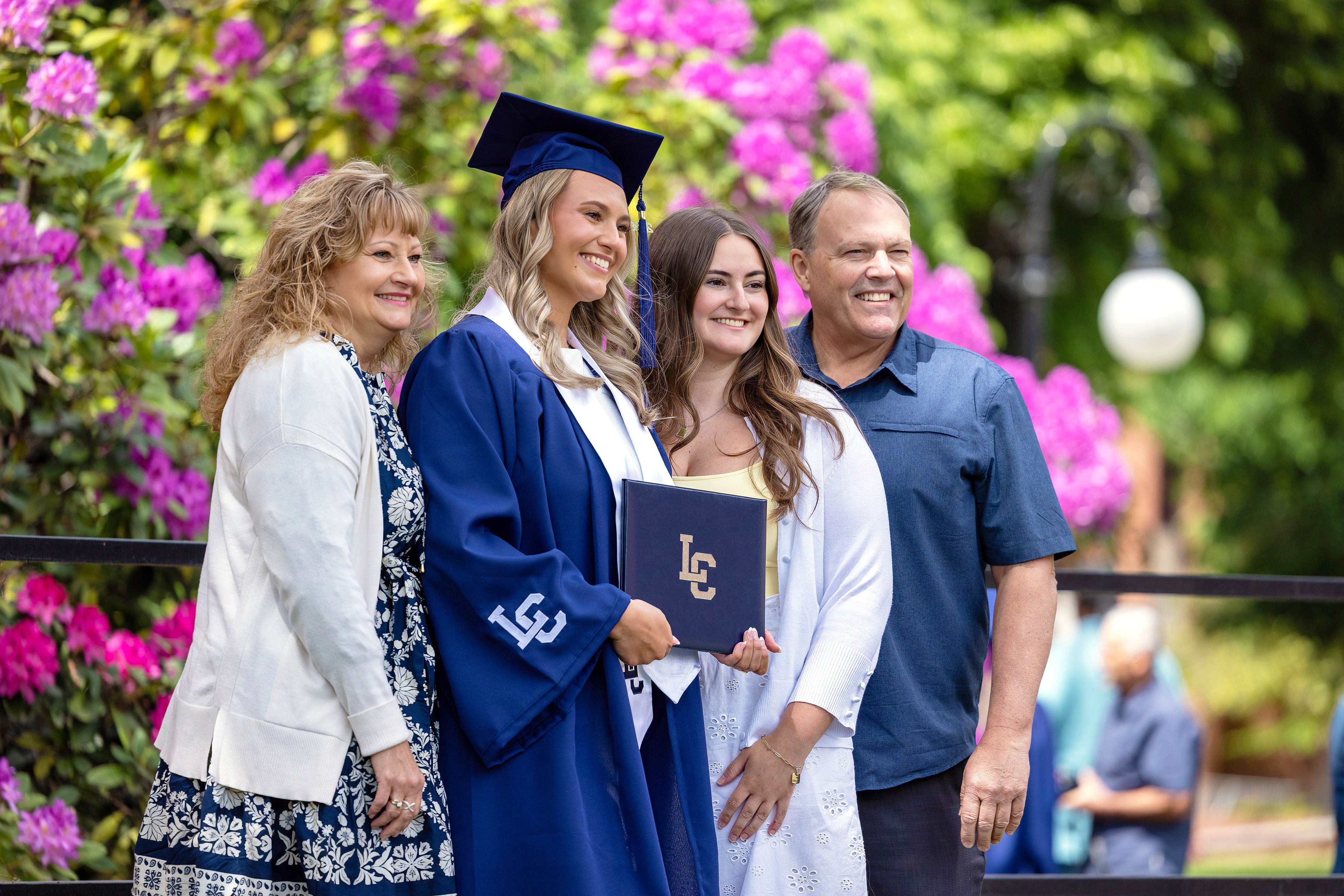 Gradute with family at commencement