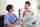 Two doctors talking in front of a laptop