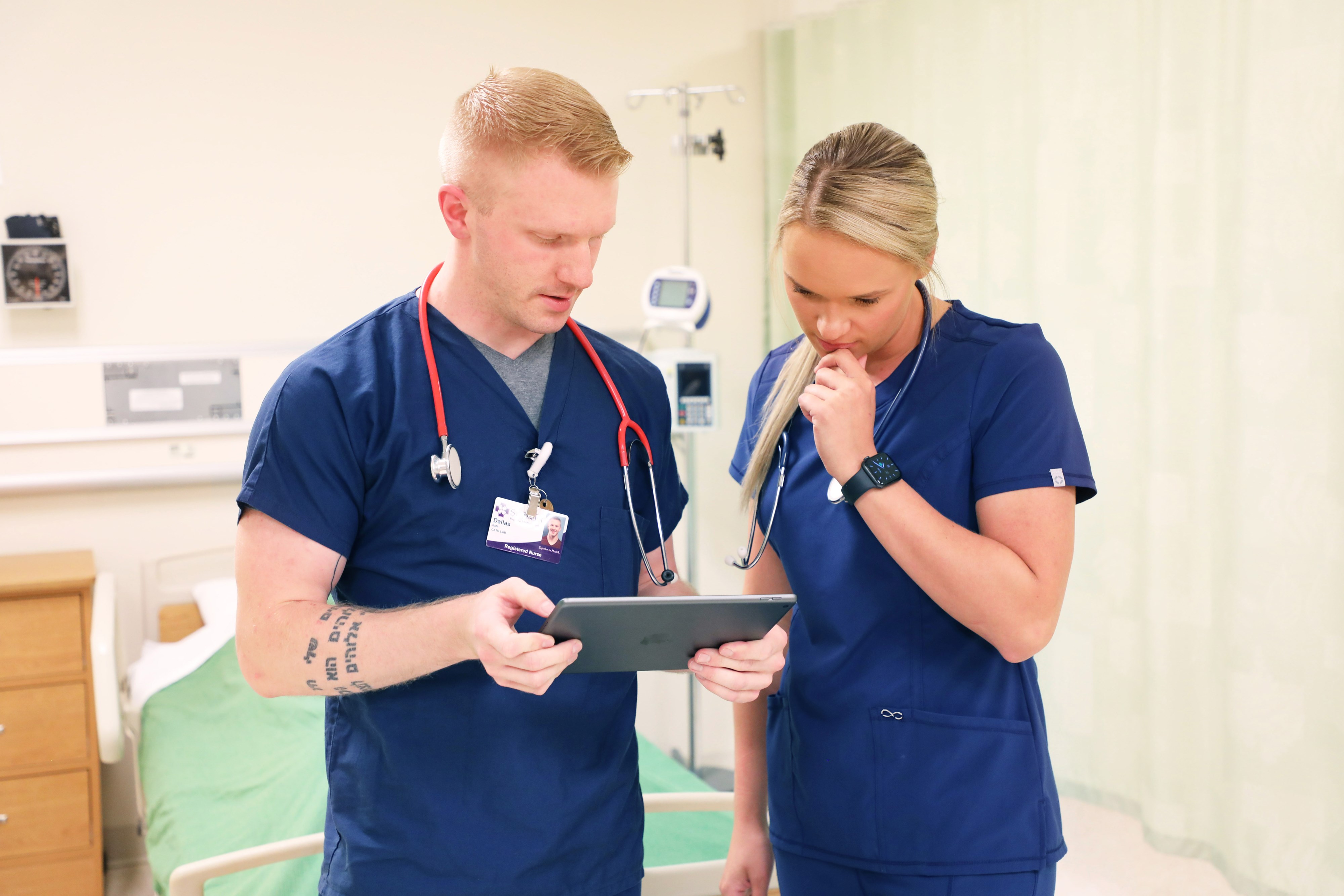 Two nurses looking at chart together