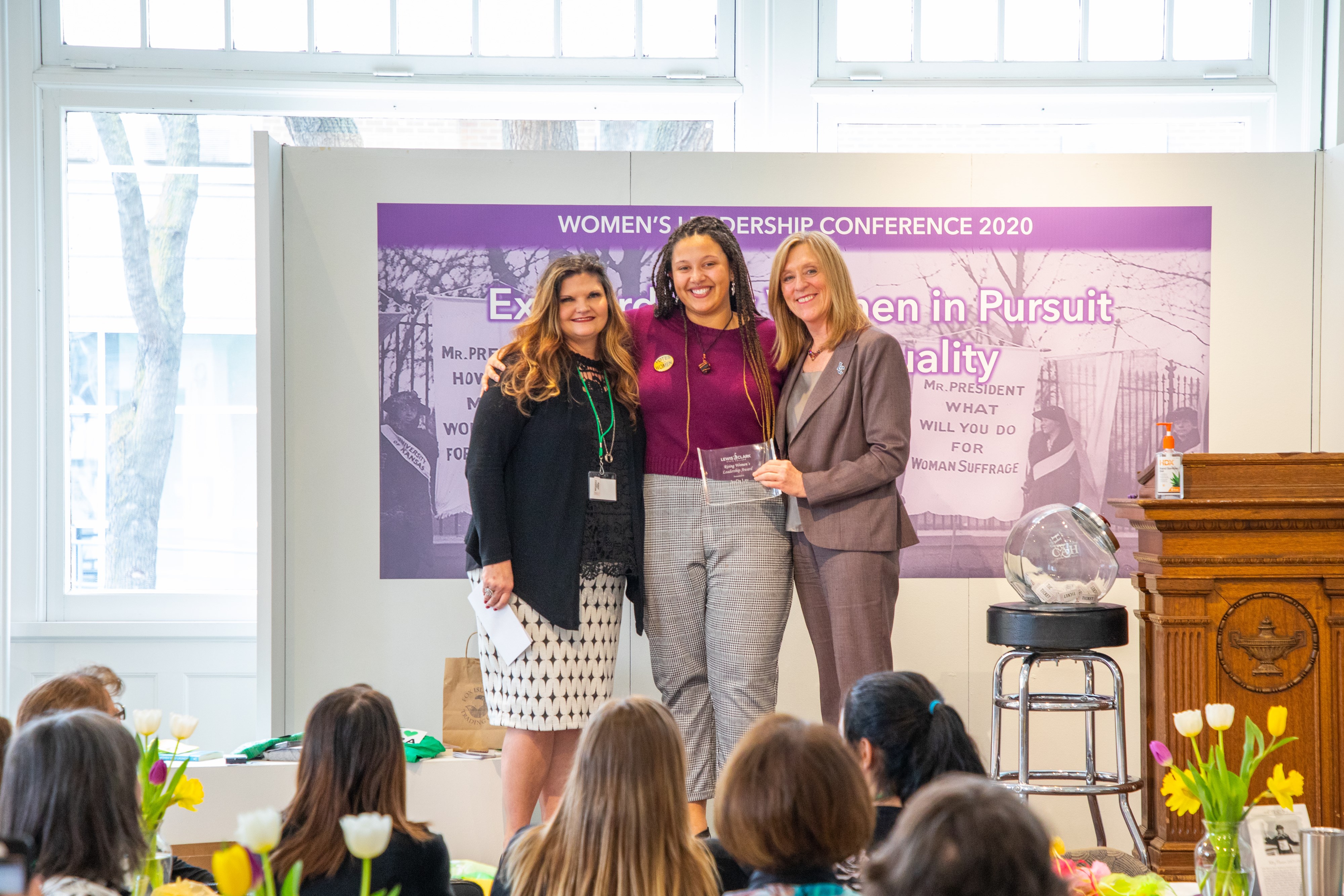 Picture of three women being honored at Women's Leadership Conference