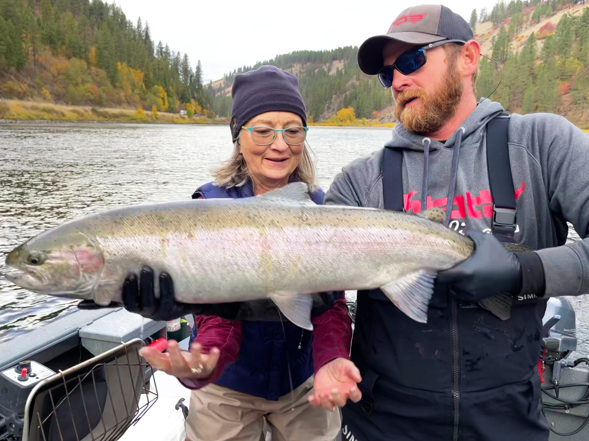Cally Roach shows off the steelhead she caught while visiting the Lewiston area during the fall