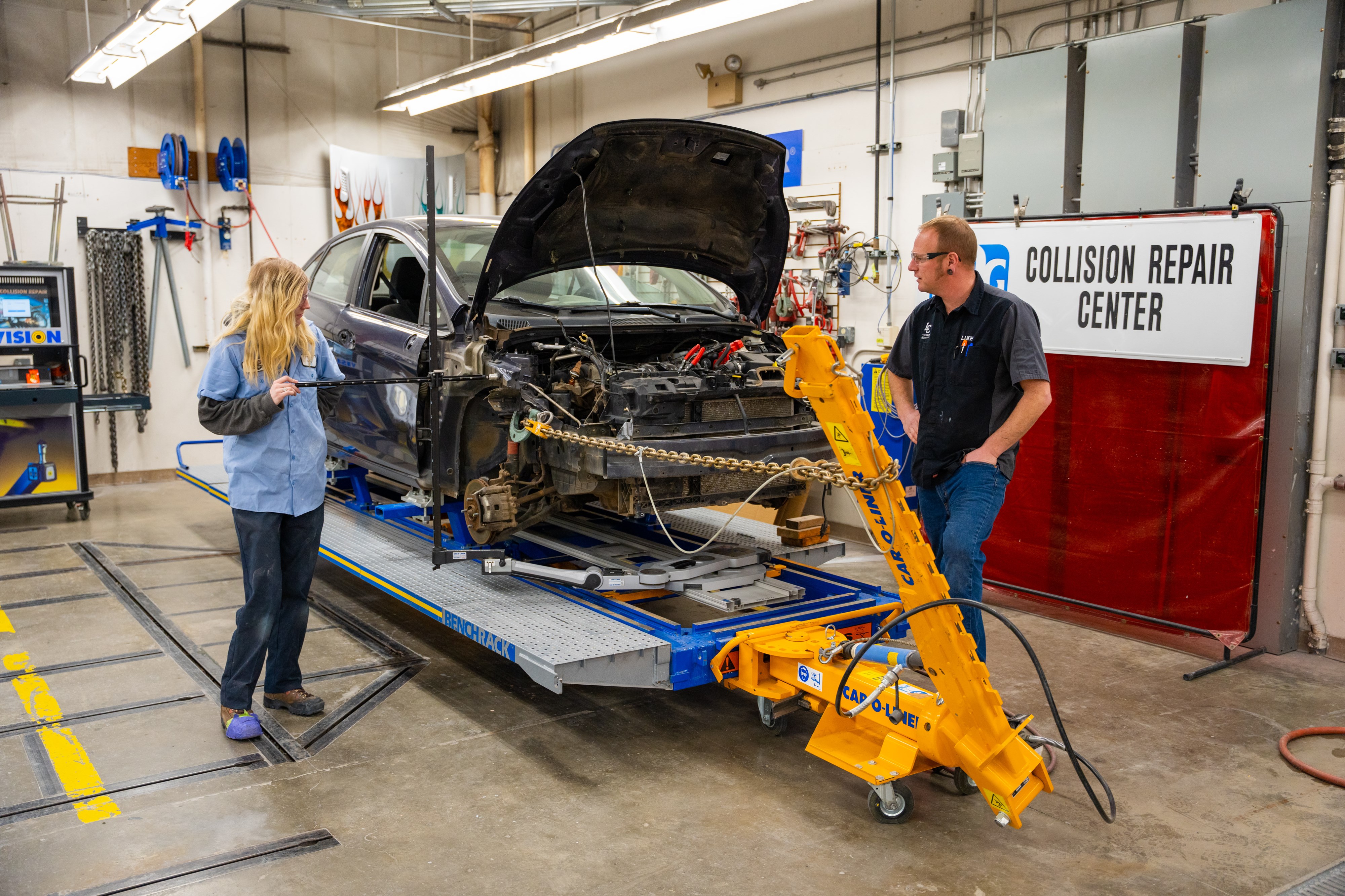 LC State collision repair student Charlotte Coronado works on a vehicle. 