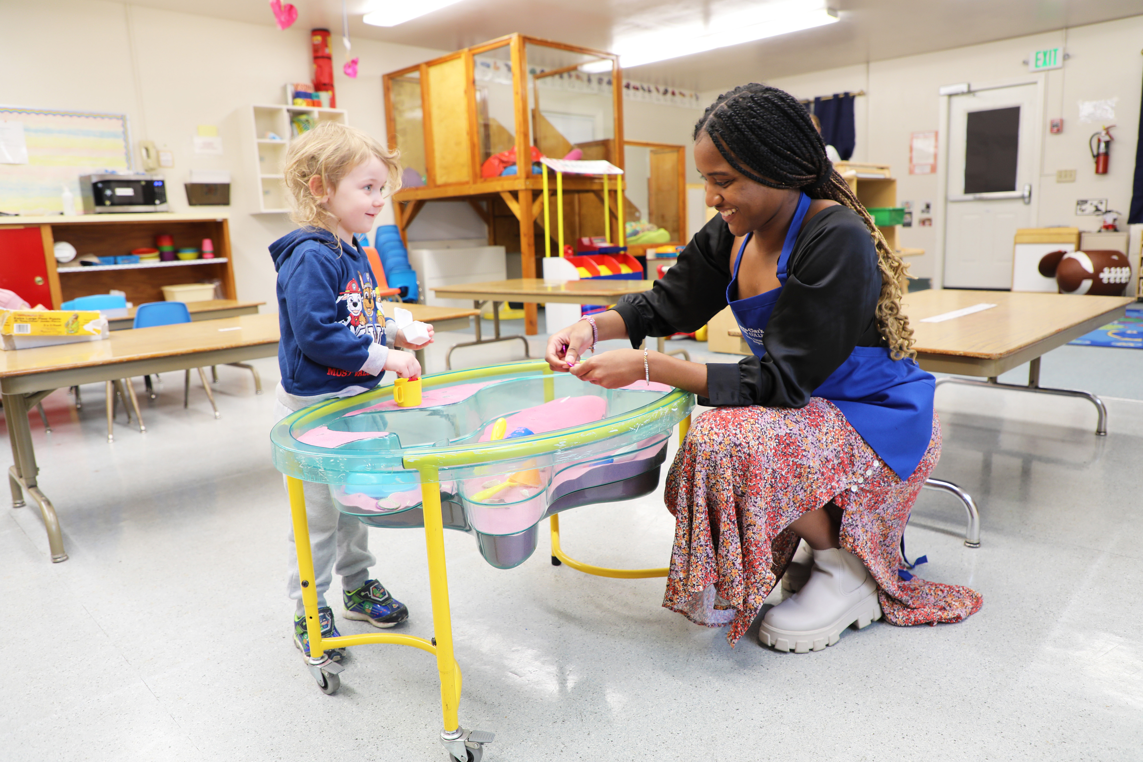 Early Childhood Development student with child