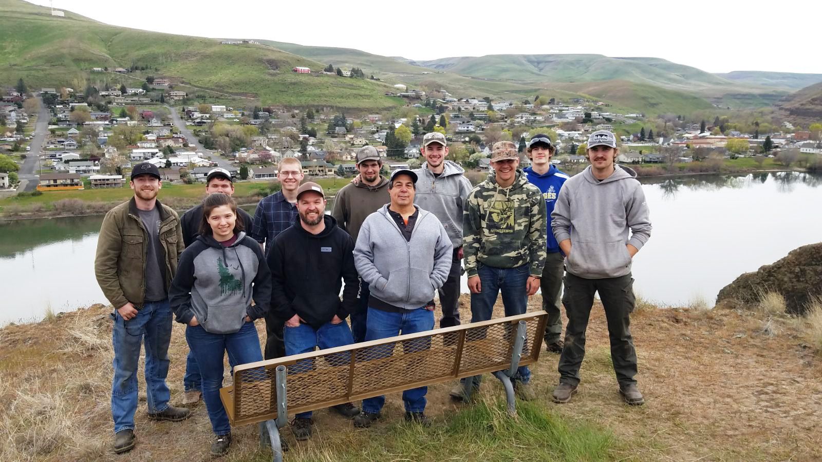 LC State welding technology students standing behind the bench they built at Hells Gate State Park