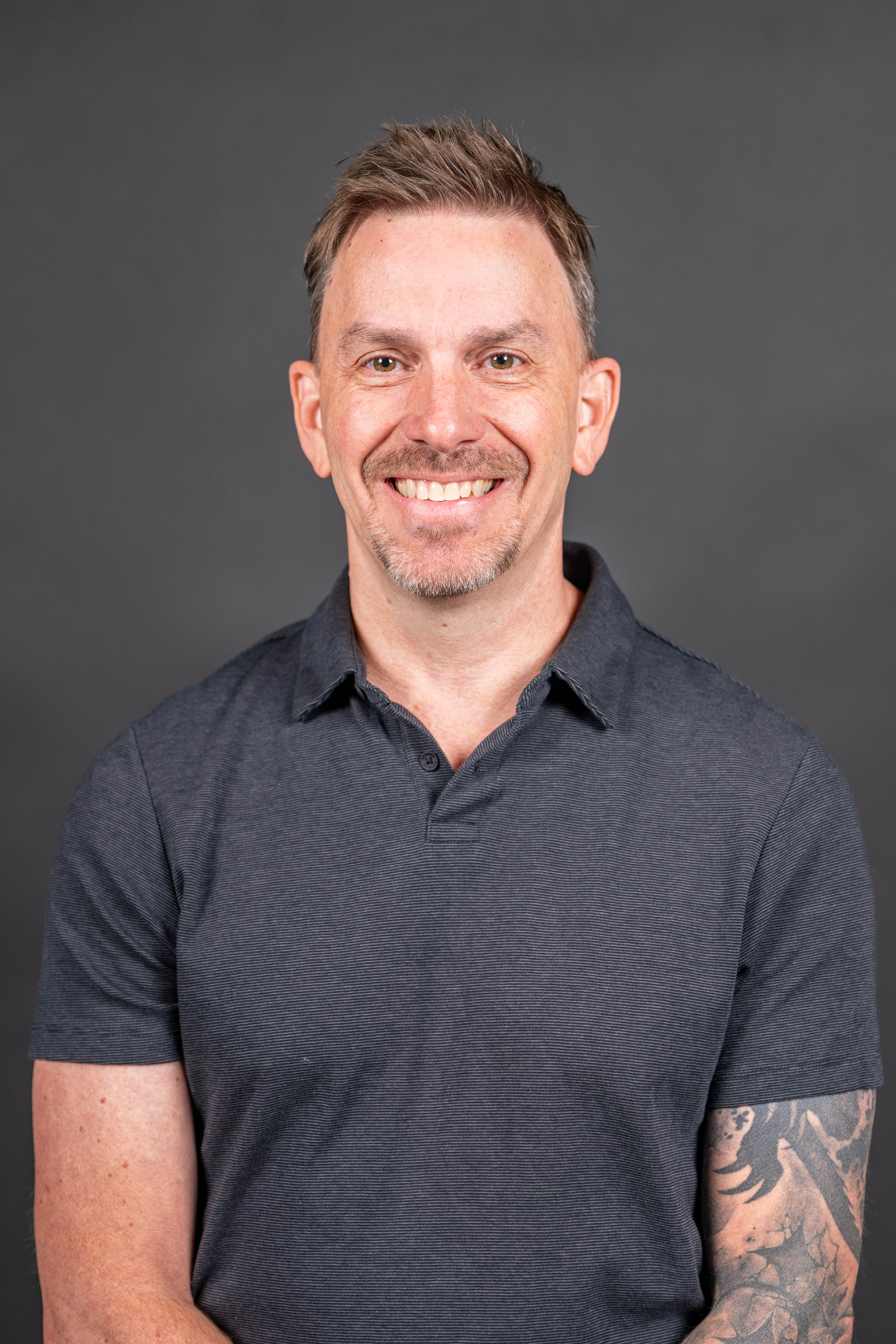 Professional headshot of Greg Stout