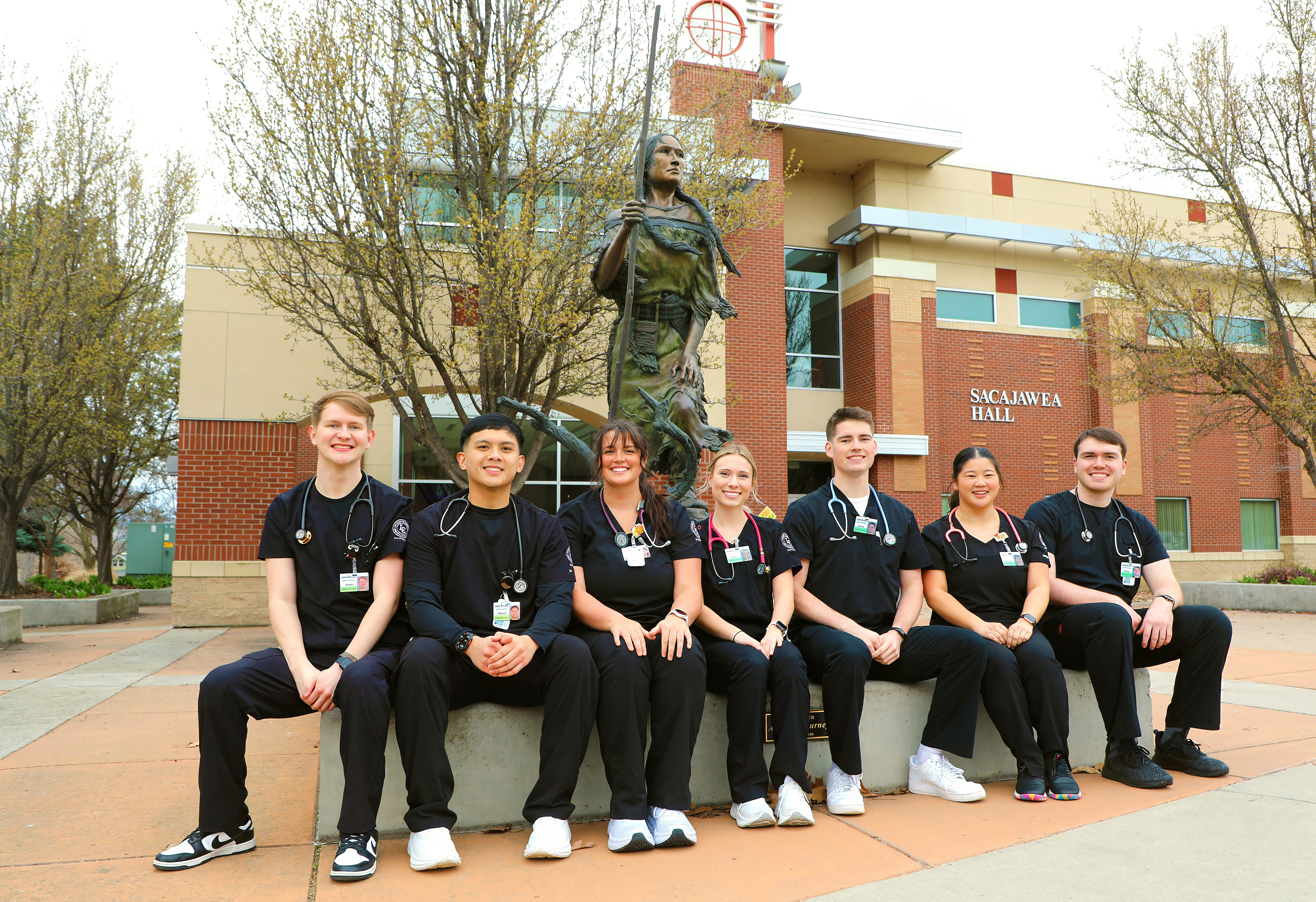 LC State nursing students pose for a photo in front of Sacajawea Hall on campus