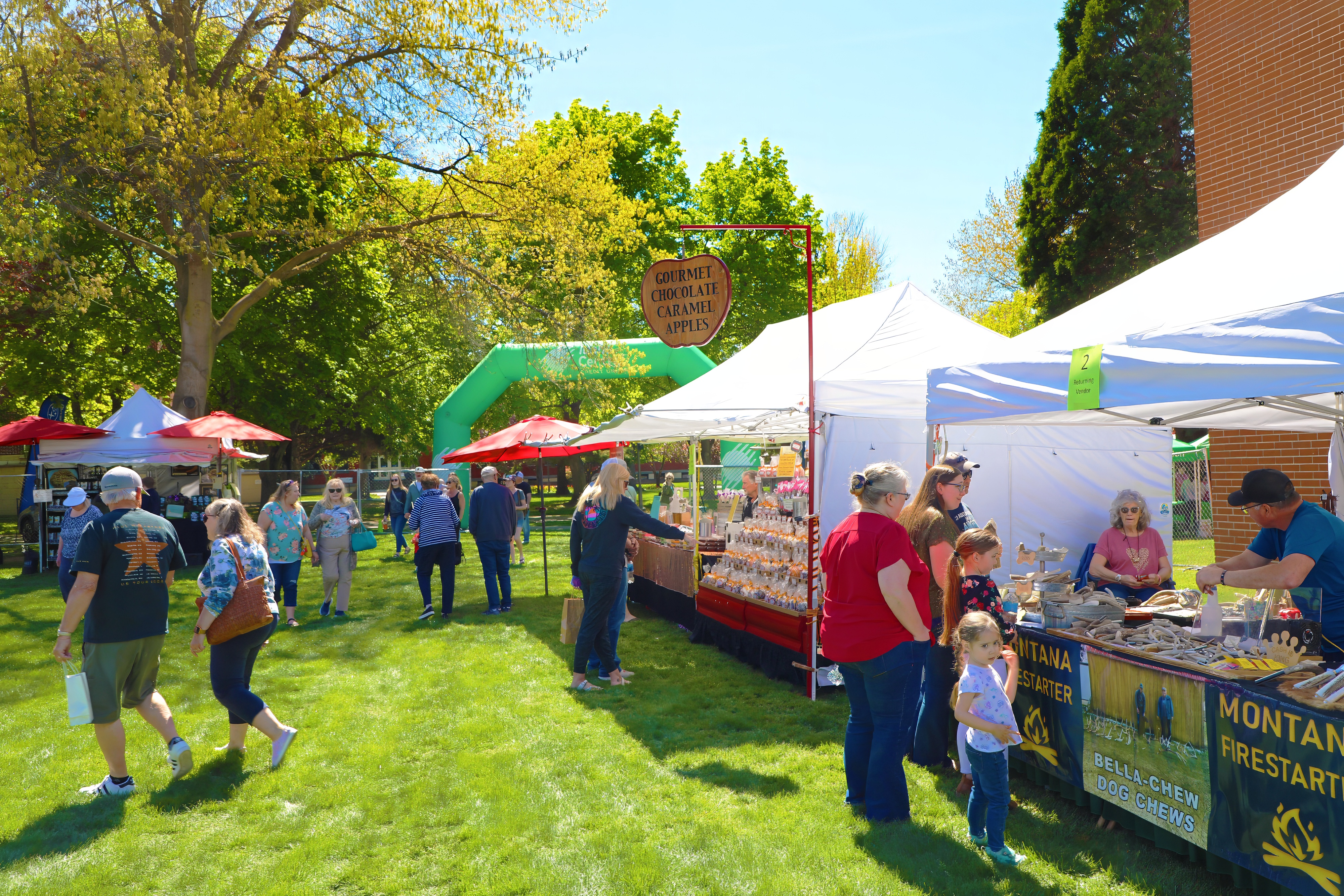 Shoppers visit booths at the 2025 Art Under the Elms