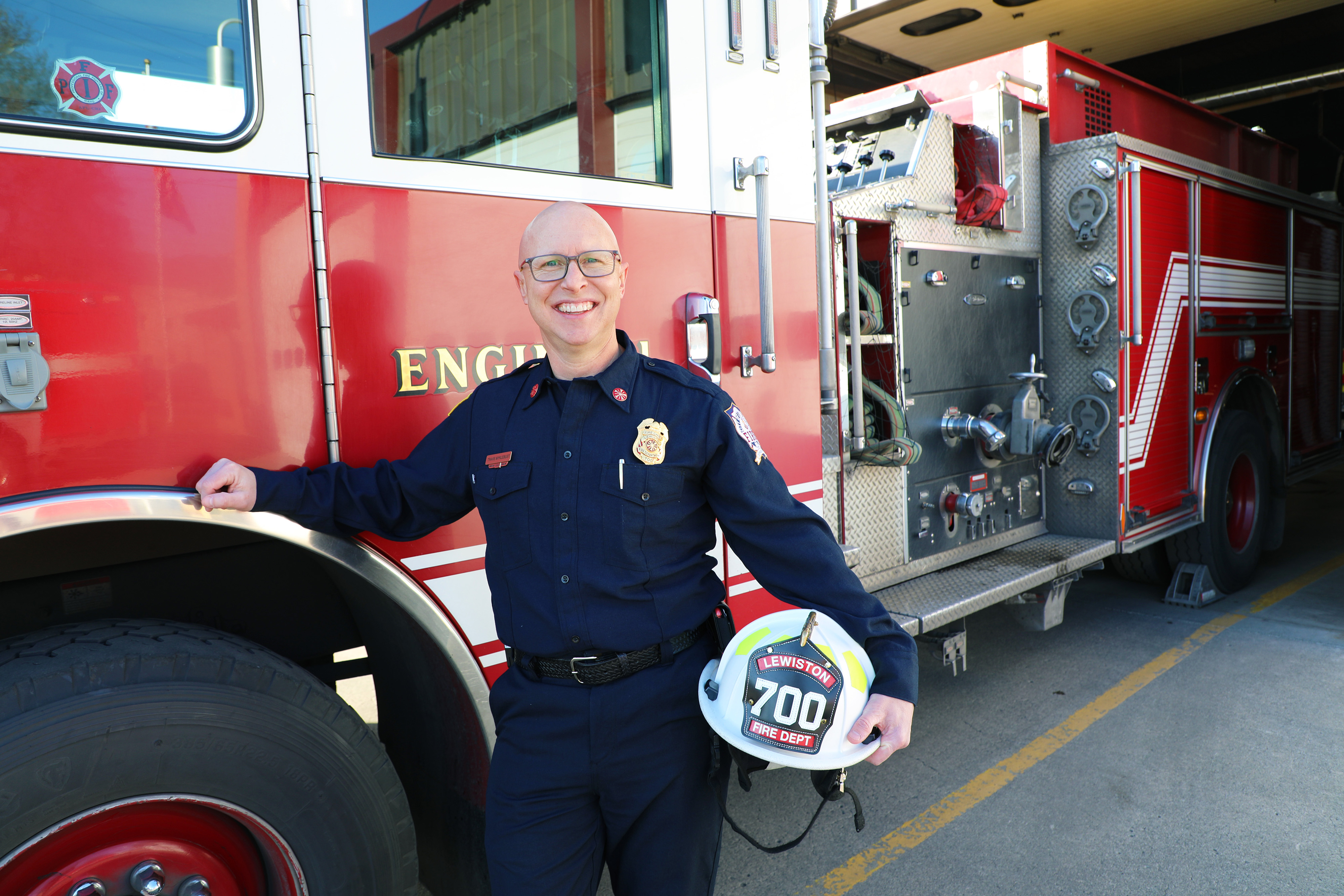LC State Instructor Travis Myklebust posed in front of fire truck