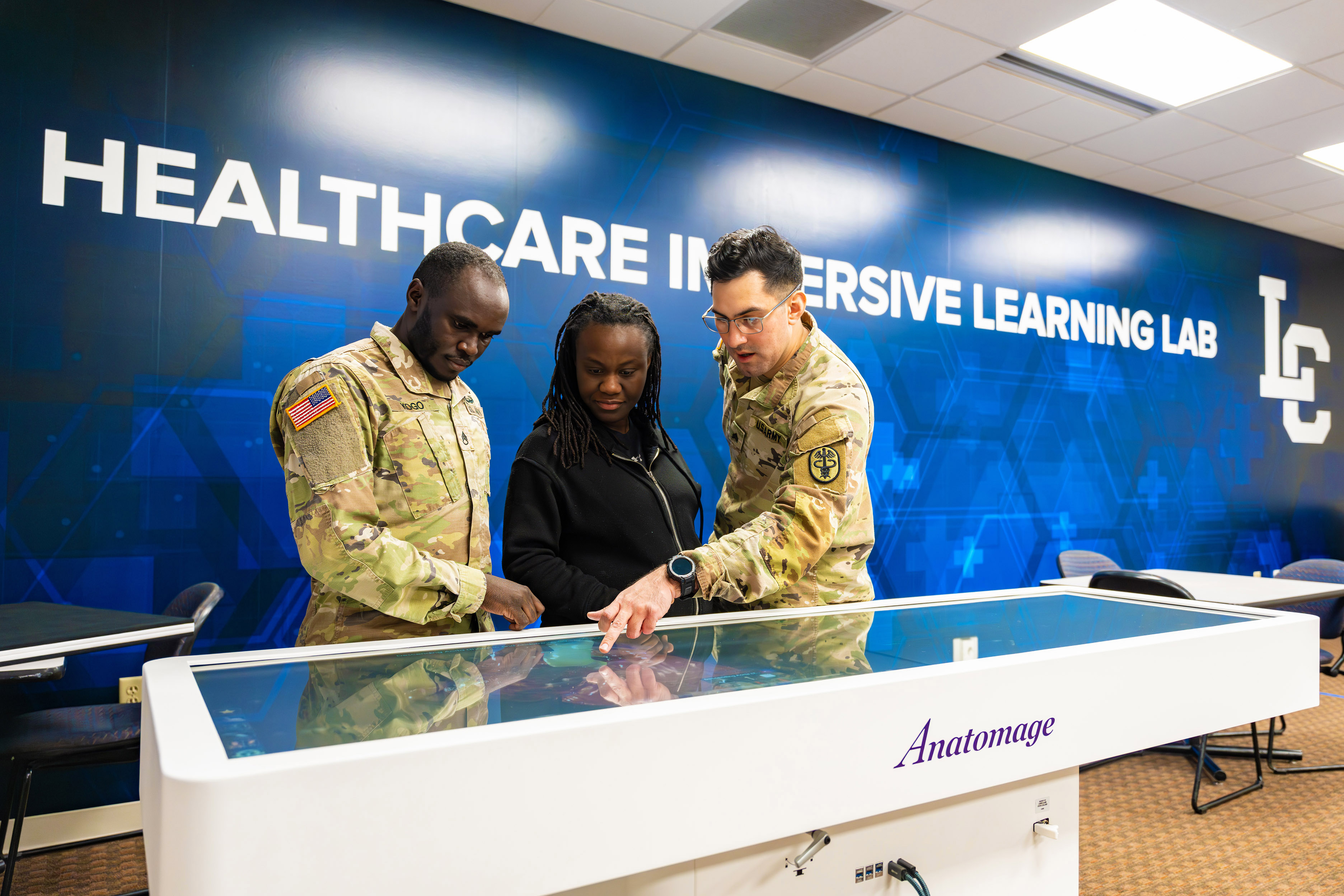 Active duty nursing students use the Anatomage in the Lewis-Clark State College Healthcare Immersive Learning Lab.
