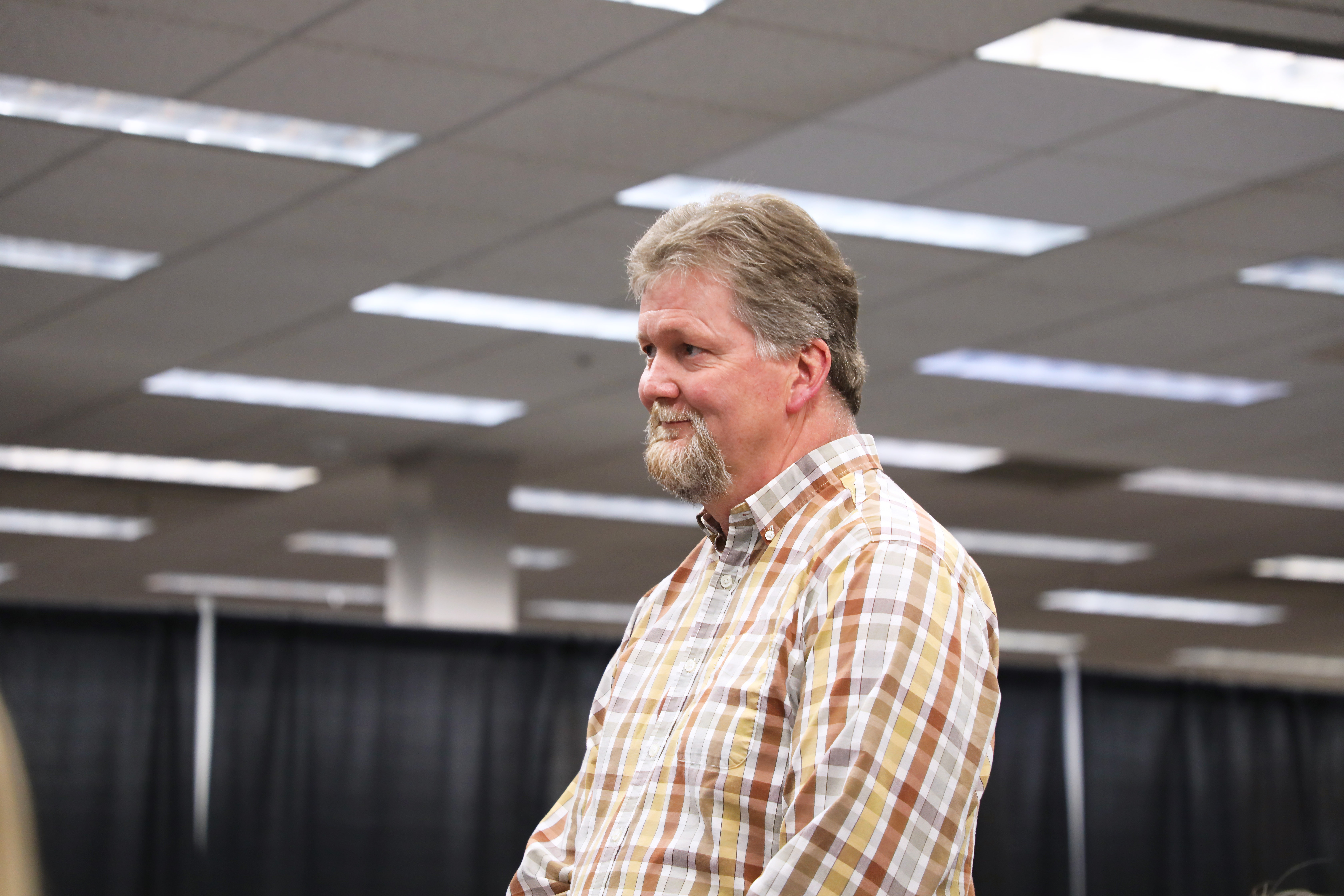 Tony Havens stands to receive his Outstanding Teacher Educator award