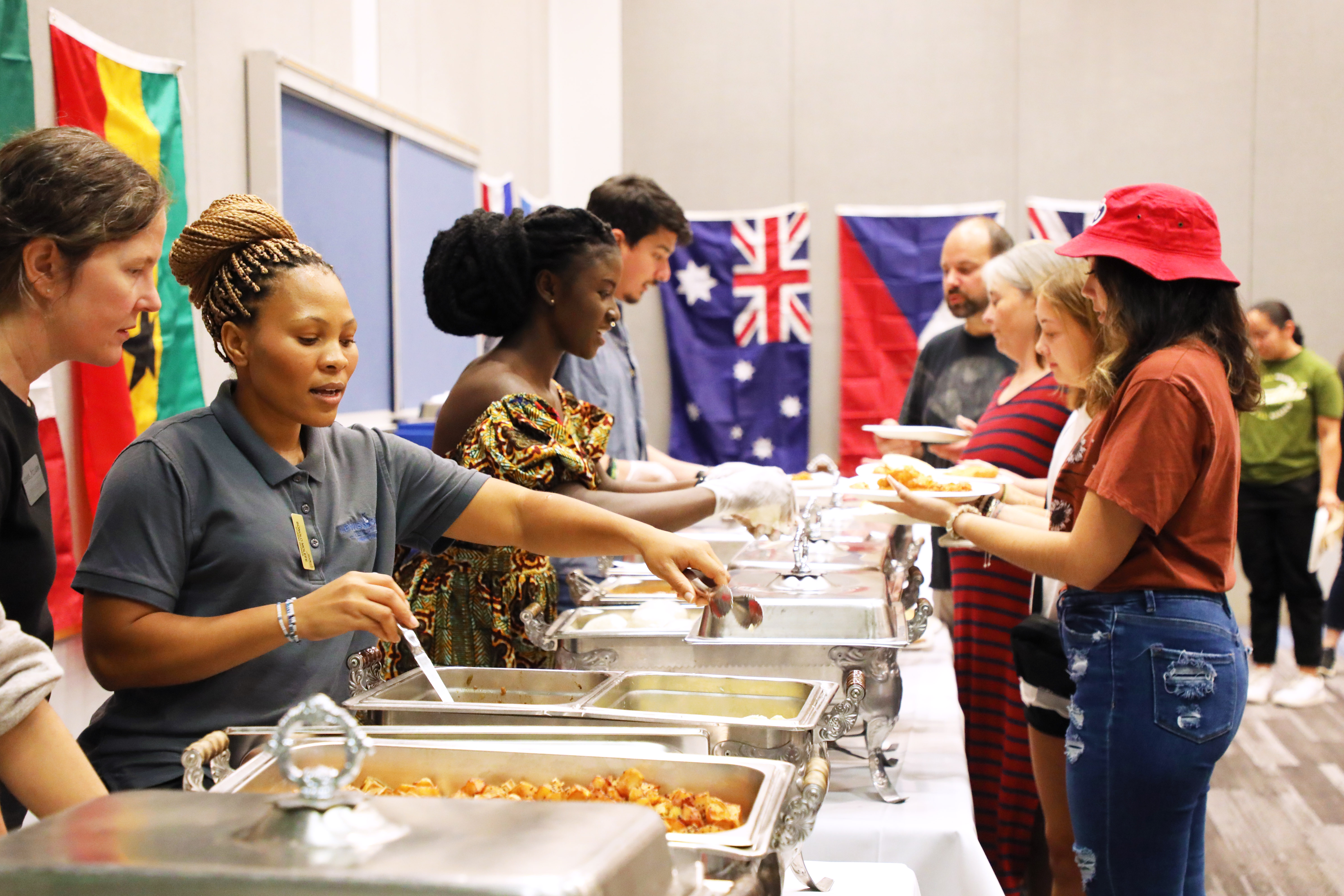 Students dishing up at food and culture night