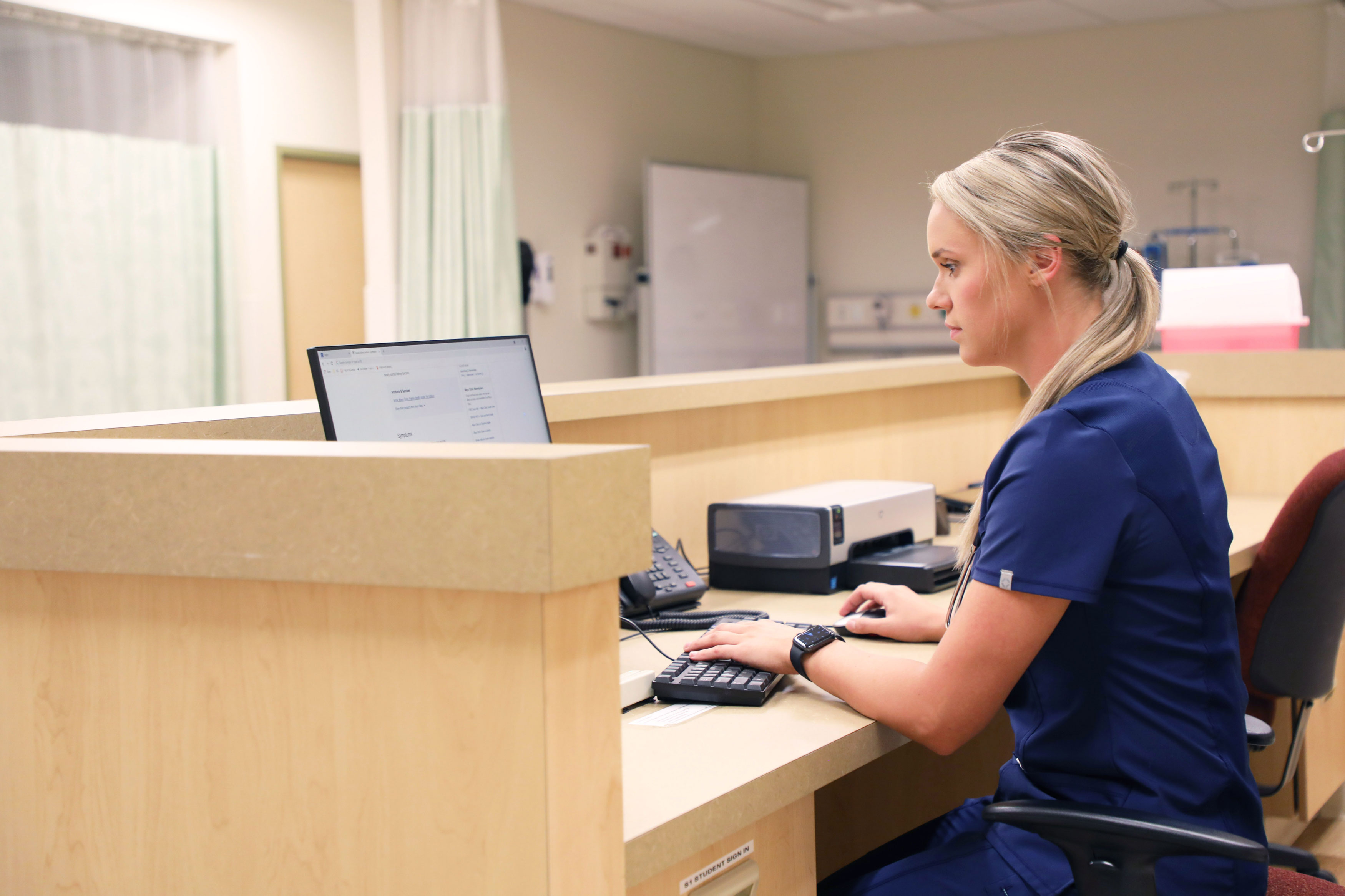Nursing student working at computer