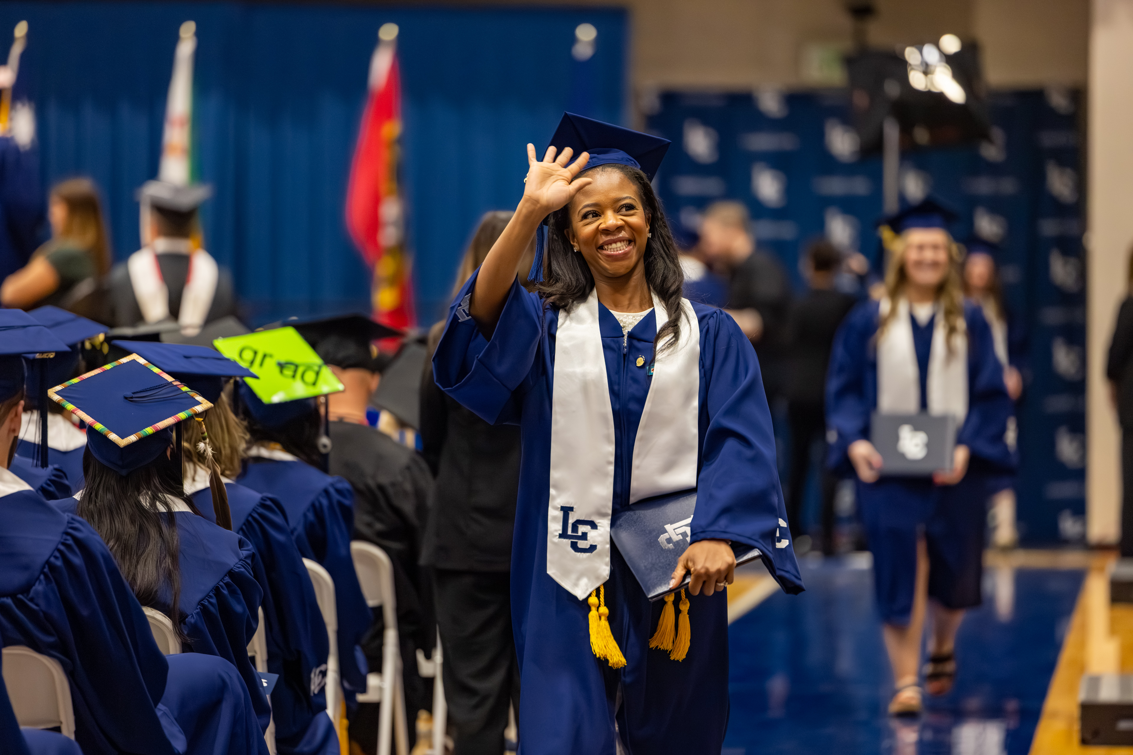 Graduate walking at commencement