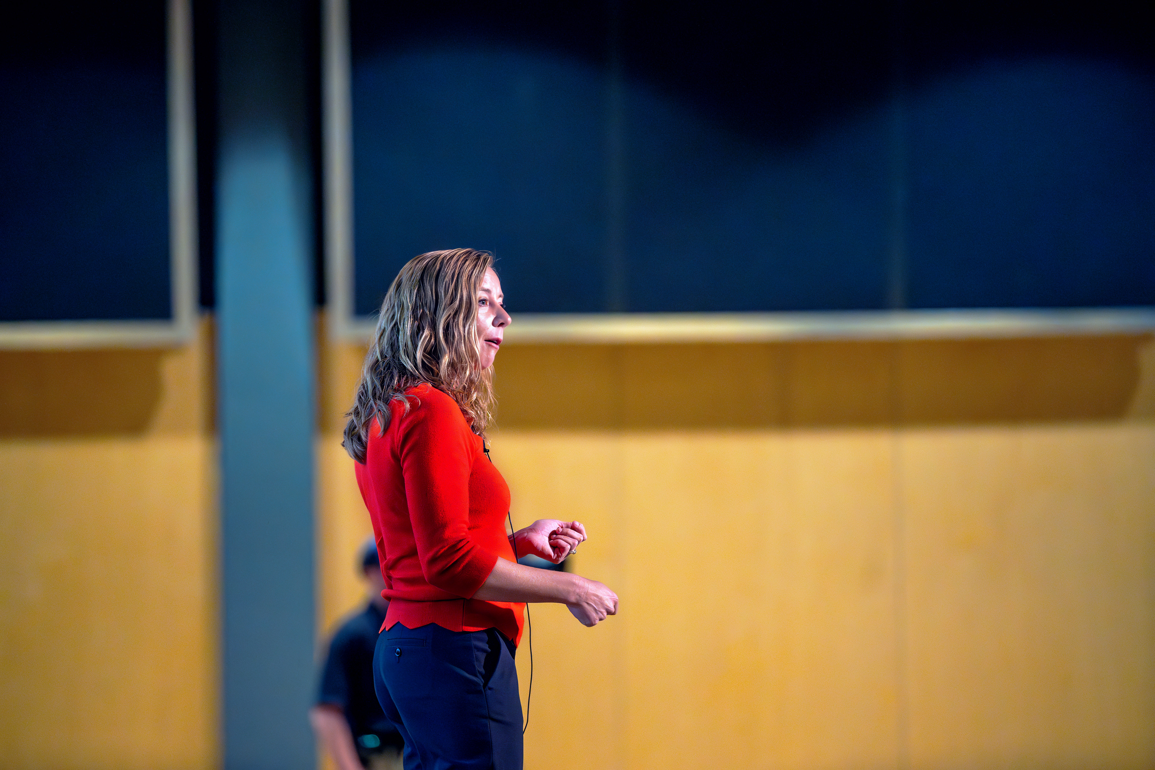 Side shot of Bethaney Fehrenkamp speaking on stage 