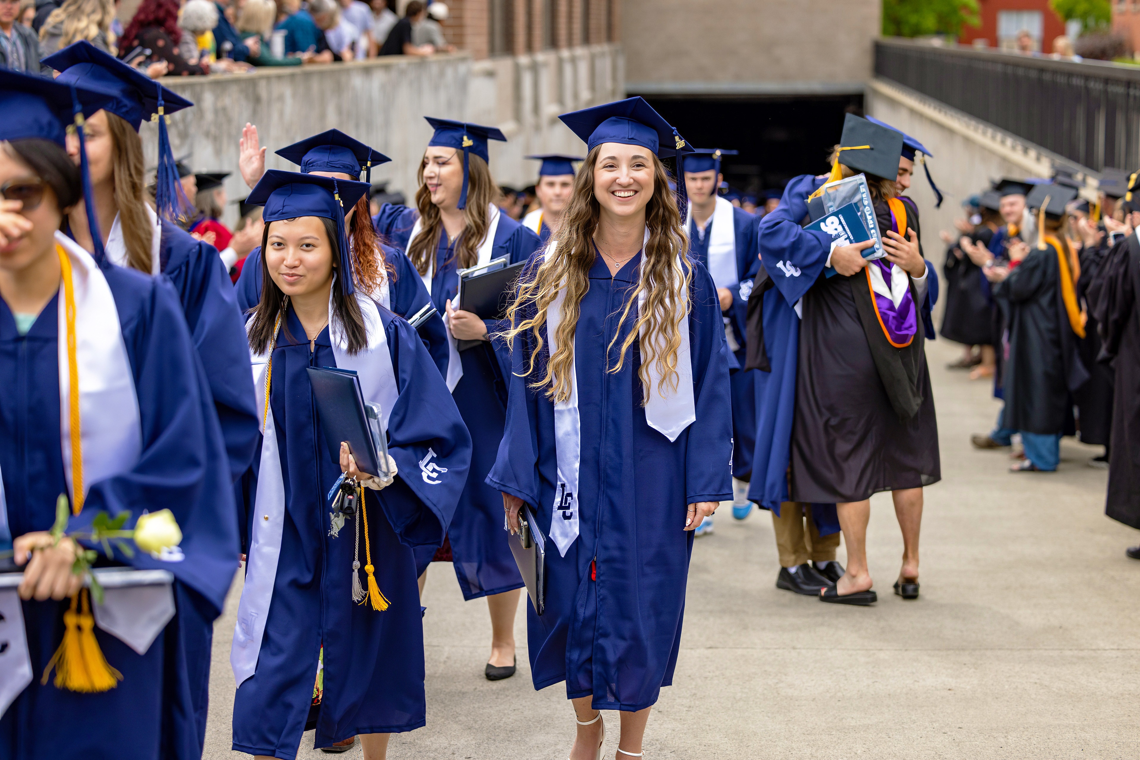 Graduates walking up the ramp at graduation